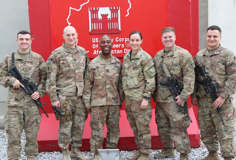 Members of the 264th Engineer Clearance Company join USACE Afghanistan District Commander, Col. Jason Kelly in front of the District Headquarters at Bagram.