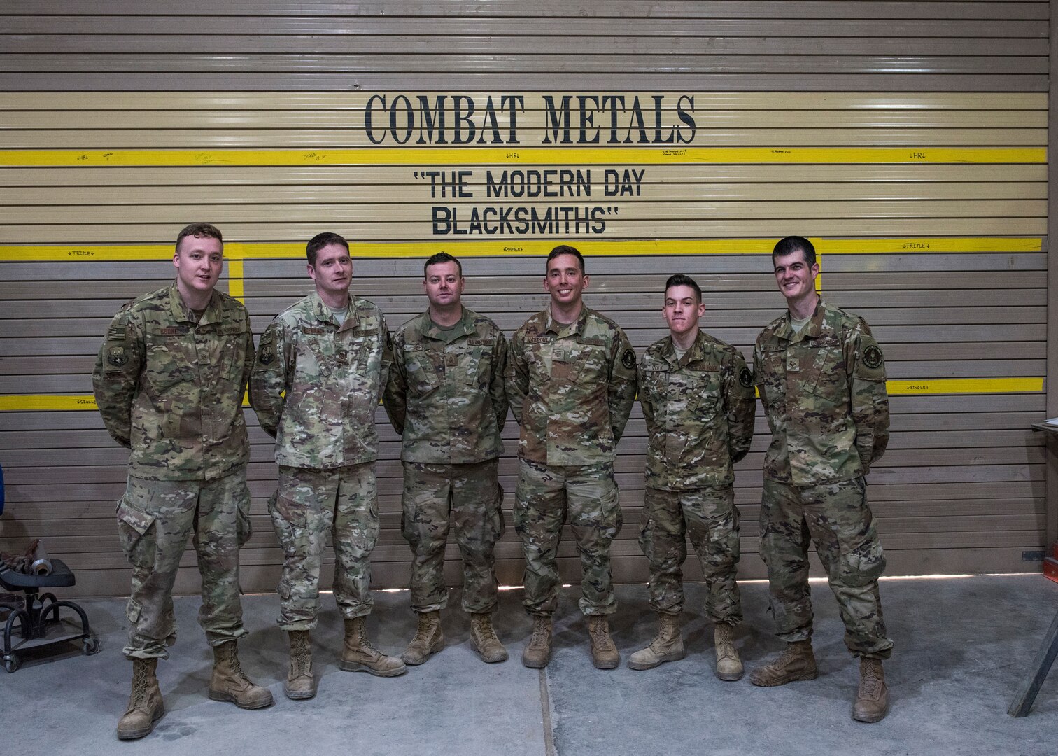 The 386th Expeditionary Maintenance Squadron combat metals flight pose for a photo at an undisclosed location in Southwest Asia, Feb. 20, 2019. This group worked around the clock to get the parts manufactured, put the wing put back together, with the ultimate goal to get the aircraft back to mission ready as fast as they could.