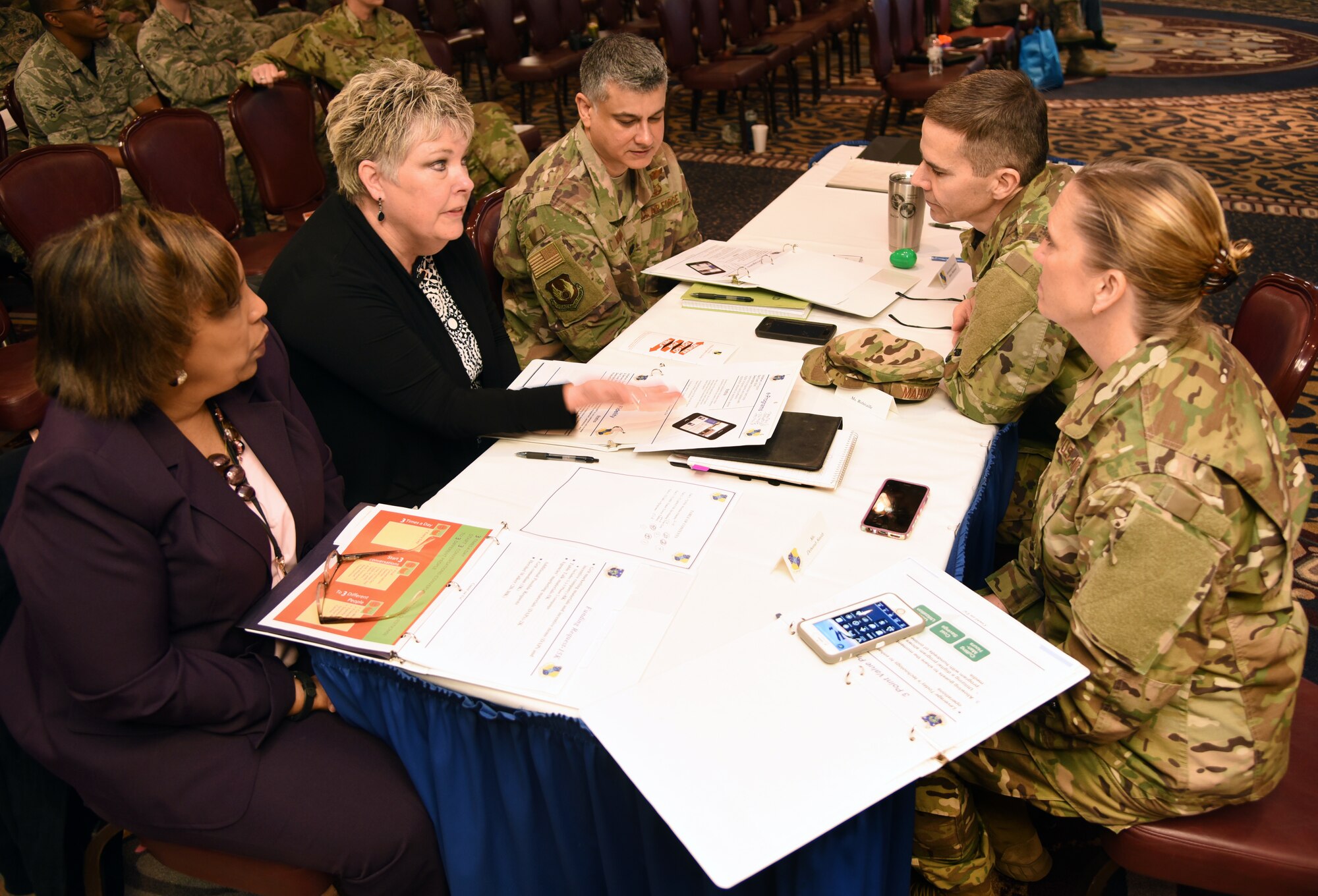 72nd Air Base Wing Spark Tank judges, from left, Deborah Smith, 72nd Contracting Squadron; Cheryl Robitaille, 72nd Comptroller Squadron; Col. Amer Mahmud, Staff Judge Advocate's Office; Col. Ralph Taylor, 72nd Air Base Wing vice commander; and Chief Master Sgt. Melissa Erb, 72nd Air Base Wing command chief, deliberate and discuss the entries for the 72nd Air Base Wing Spark Tank. (U.S. Air Force photo/Kelly White)