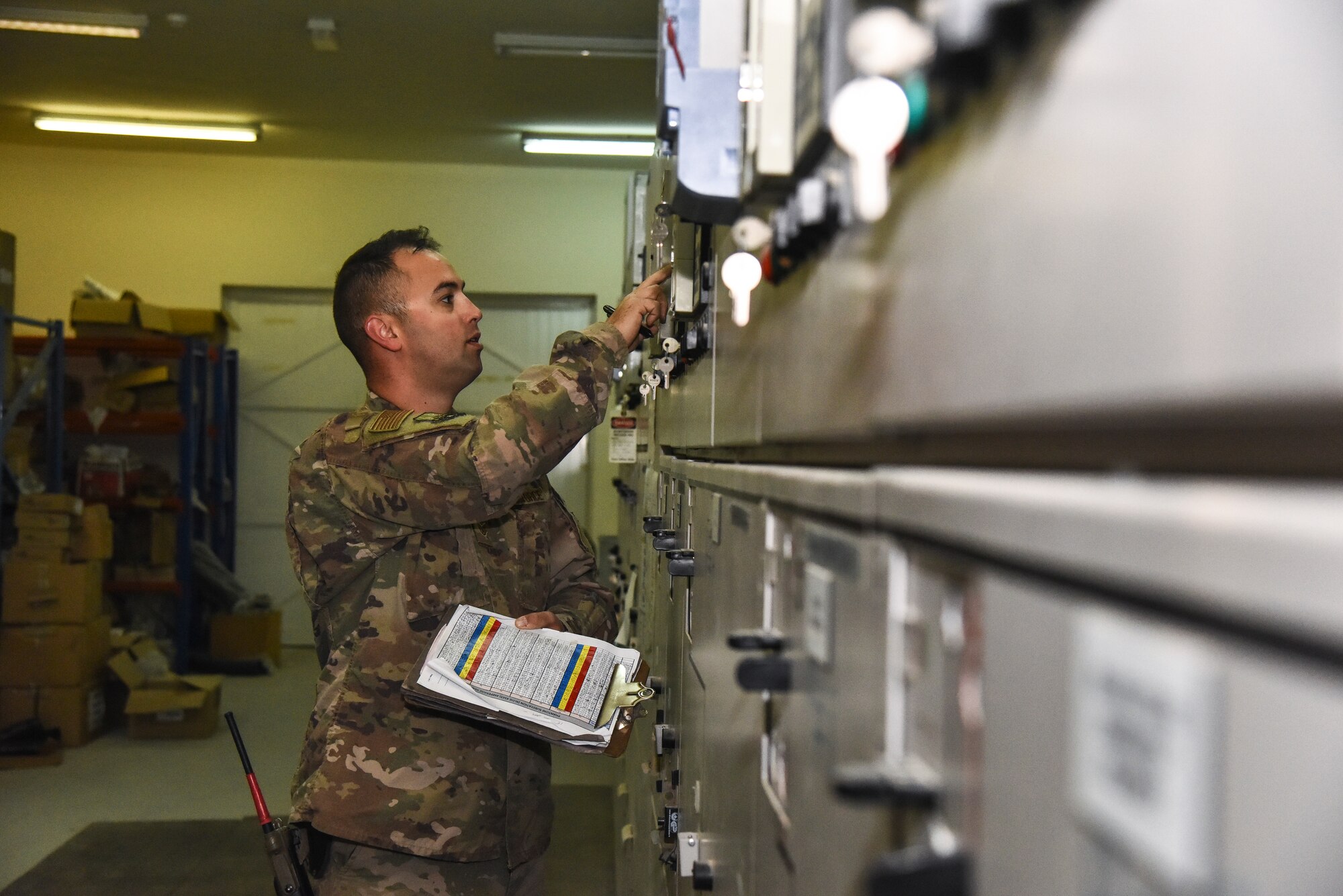 Staff Sgt. Joseph Walters, 380th Expeditionary Civil Engineer Squadron electrical systems craftsman, checks substitution meter readings, at Al Dhafra Air Base, United Arab Emirates, Feb. 18, 2019. Electrical systems specialists install, maintain, and repair energized and de-energized electrical distribution systems and components. (U.S. Air Force photo by Senior Airman Mya M. Crosby)