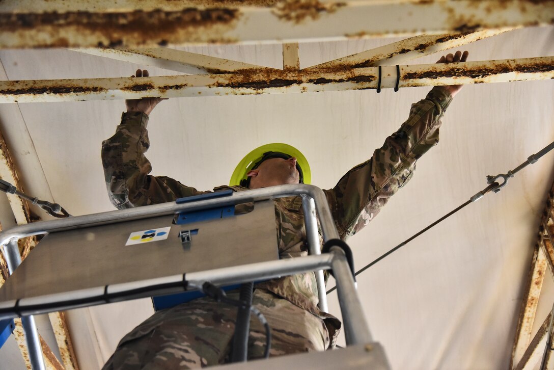 Staff Sgt. Joseph Walters, 380th Expeditionary Civil Engineer Squadron electrical systems craftsman, traces electrical circuits, at Al Dhafra Air Base, United Arab Emirates, Feb. 18, 2019. Electrical systems specialists inspect, maintain, and repair fixed and portable airfield lighting systems including runway, threshold and distance marker lights. (U.S. Air Force photo by Senior Airman Mya M. Crosby)
