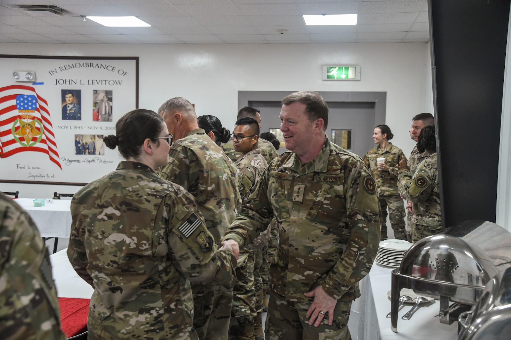 U.S. Air Force Lt. Gen. Richard Scobee, commander of Air Force Reserve Command, meets reservists during his visit to Al Dhafra Air Base, United Arab Emirates, Feb. 13, 2019.