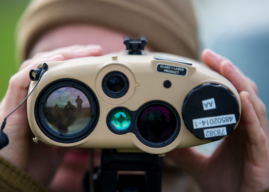 A U.S. Marine with Special Purpose Marine Air-Ground Task Force-Crisis Response-Africa 19.1, Marine Forces Europe and Africa, uses a Common Laser Range Finder-Integrated Capability system to locate notional targets during a close-air-support training event with the British Royal Air Force at Holbeach Range, England, Feb. 20, 2019. SPMAGTF-CR-AF is a rotational force deployed to conduct crisis-response and theater-security operations in Europe and Africa. (U.S. Marine Corps photo by Sgt. Katelyn Hunter)