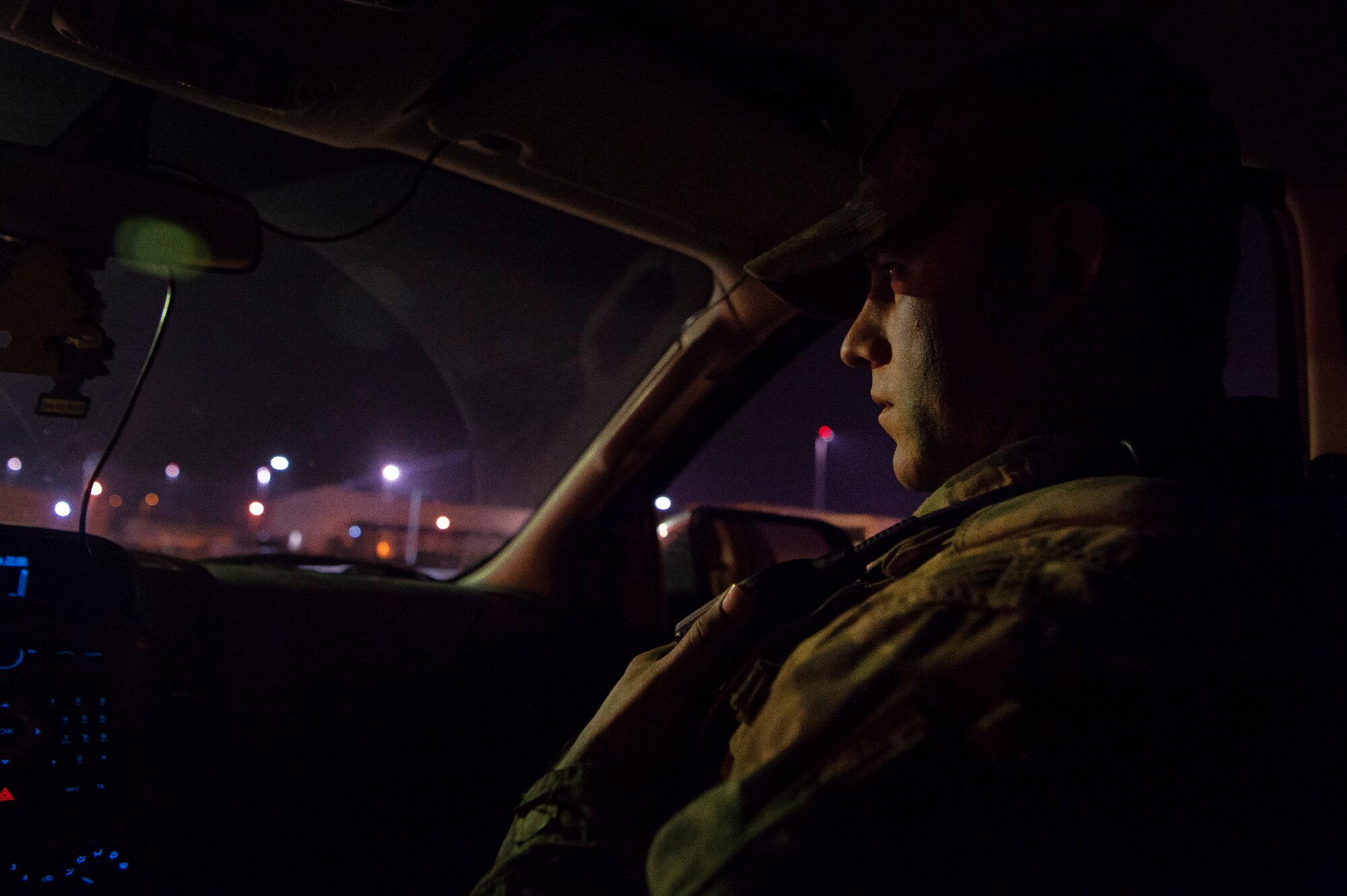 Master Sgt. Jordan Barnes, 379th Expeditionary Security Forces Squadron (ESFS) combined response joint patrol leader, listens to his radio while on patrol Jan. 17, 2019, at Al Udeid Air Base, Qatar. Barnes conducts “Spartan Patrols,” where he works side-by-side with Qatar Military Police (QMP) to conduct installation perimeter checks. Together, members of 379th ESFS and QMP ensure assets and personnel are safe at Al Udeid, and there are no vulnerabilities in the installation’s perimeter. (U.S. Air Force photo by Tech. Sgt. Christopher Hubenthal)