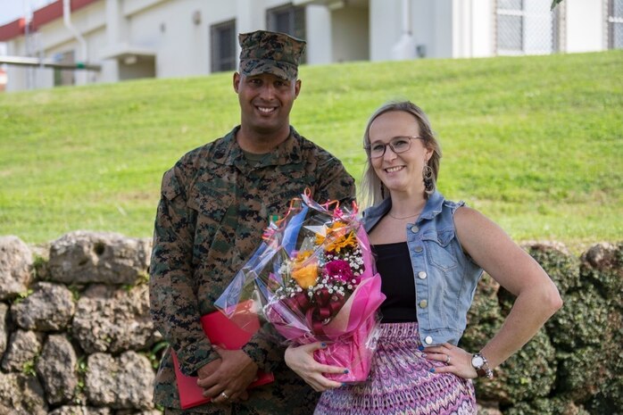 Staff Sgt. Jonathan McClure, left, and Jillian Romag, right, pose for a picture February 22, 2019, aT Camp Foster, Okinawa, Japan. McClure was awarded the Navy Achievement Medal for superior performance of duty while serving as a military policeman and accident investigation section chief Provost Marshal’s office, H&S Bn, MCIPAC-MCB. With quick thinking and a bias for action, McClure rescued Romag from choking at a local restaurant.