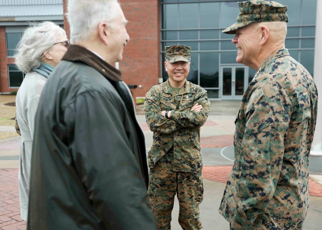 Commandant of the Marine Corps, Gen. Robert B. Neller, and the commander of U.S. Marine Corps Forces, Special Operations Command, Maj. Gen. Daniel D. Yoo, with the family of Master Sgt. Thomas A. Saunders after MARSOC’s 13th Anniversary Ceremony at Marine Corps Base Camp Lejeune, N.C. , February 21, 2019. Saunders, who was killed in a training accident in March of 2015, is one of 43 souls lost in combat and in training. The anniversary event included a battle colors rededication ceremony to recognize some of the collective  achievements by the service component. The commander, Maj. Gen. Daniel D. Yoo, also recognized Marines and Sailors for their exemplary performance. Since the unit’s inception, Raiders, a name adopted in 2015 in recognition of their forbearers, have earned more than 300 valor awards. Raiders have found themselves in 17 countries to conduct more than 300 operational deployments, ranging from 14-man Marine Special Operations Teams, to Combined Joint Special Operations Task Forces overseeing American and coalition special operations forces; a scalable force, much like their conventional Marine brethren. (U.S. Marine Corps photo by Cpl. Bryann K. Whitley)