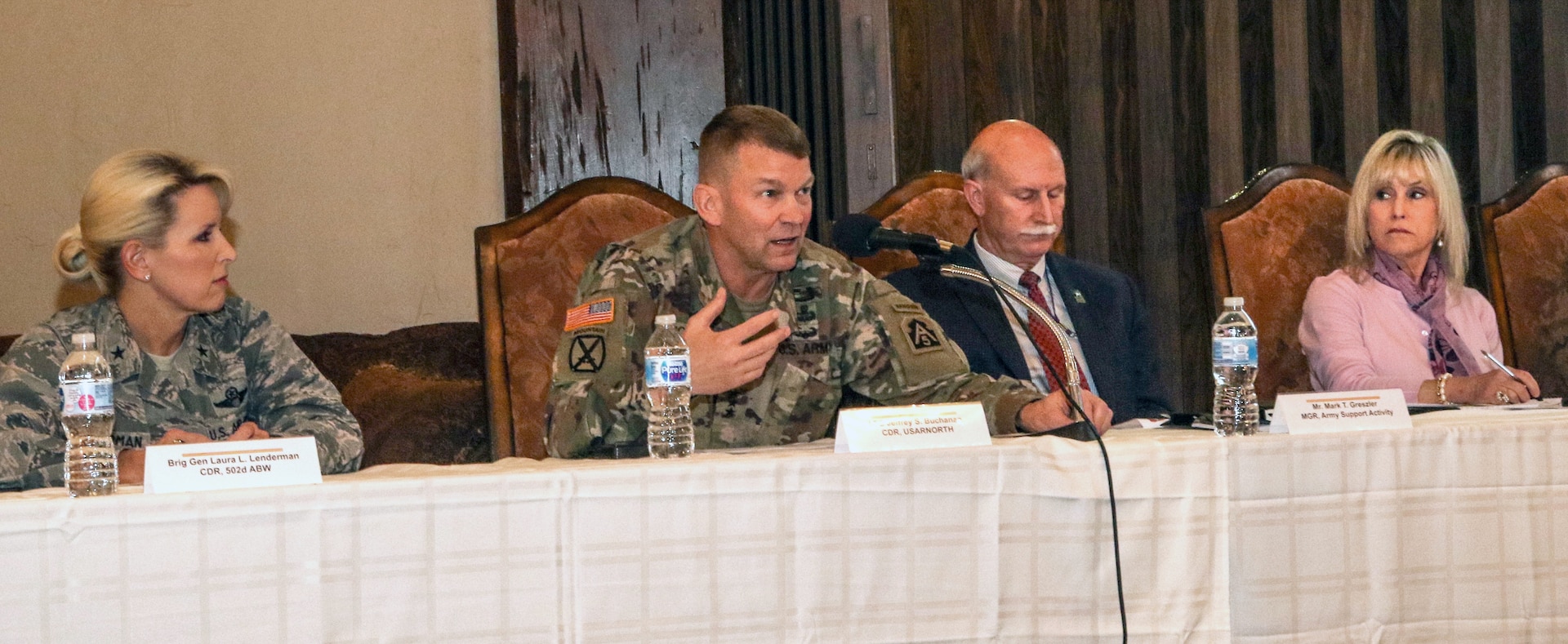 Lt. Gen. Jeffrey S. Buchanan (second from left), U.S. Army North Commander and Senior Army Commander for Joint Base San Antonio-Fort Sam Houston, as well as leaders from JBSA-Fort Sam Houston like Brig. Gen. Laura L. Lenderman (left), 502nd Air Base Wing and JBSA commander, and Lincoln Military Housing officials answer questions and address issues from Soldiers and their families during a town hall meeting at the Lincoln Military Housing Community Center Feb. 21. The town hall was a platform for Soldiers and family members to provide information and gain feedback as part of an ongoing U.S. Army-wide effort to resolve unsatisfactory conditions in Army family housing.