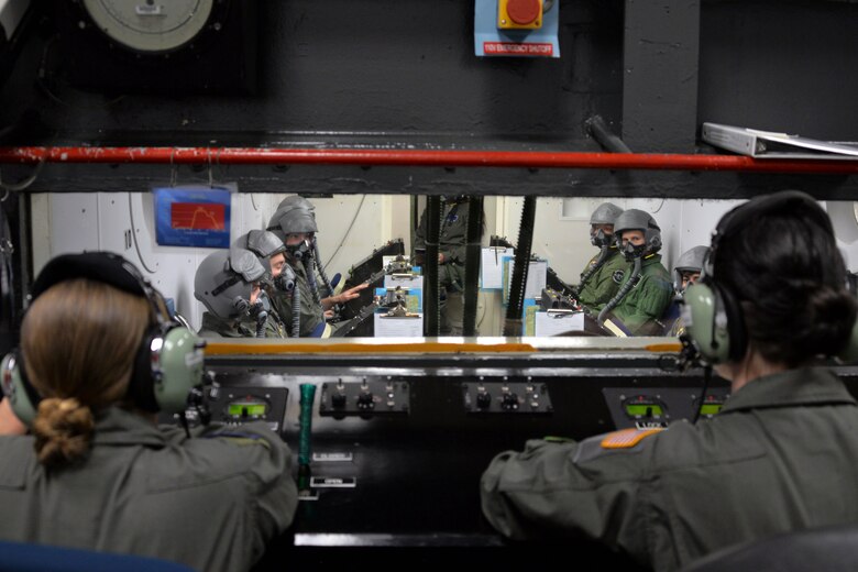 Airman 1st Class Emily Diblasio and Senior Airman Amber Davis, 82nd Aerospace Medical Squadron Squadron physiology technicians, assist Pilot Training Next 2.0 students during a hypobaric chamber flight at Sheppard Air Force Base, Texas, Jan. 28, 2019. The second class of students participating in Pilot Training Next at the Armed Forces Reserve Center in Austin, Texas, began Jan. 17.   (U.S. Air Force photo by Airman 1st Class Madeleine E. Remillard)