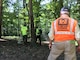 U.S. Army Corps of Engineers Project Manager Alex Zahl looks on as crews use a Manned Portable Vector to classify buried metallic anomalies during geophysical surveying efforts along Dalecarlia Parkway in the Spring Valley Formerly Used Defense Site September 6, 2018. The work is part of the Site-Wide Remedial Action approved for the FUDS. The surveying is part of an effort to identify metallic anomalies below the surface that could be munitions left in the ground as a result of military activity in the area during World War I. The MPV equipment helps determine whether buried metallic anomalies are munitions items that may potentially be hazardous or cultural debris that do not need to be removed.