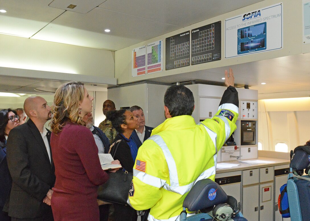 U.S. Congresswoman Katie Hill is aboard NASA's flying research telescope aircraft SOFIA where she was given a tour and briefing from Eddie Zavala, NASA SOFIA program manager (right). SOFIA stands for Stratospheric Observatory For Infrared Astronomy. The newly elected congresswoman was given a tour of U.S. Air Force Plant 42 facilities Feb. 21. (U.S. Air Force photo by Kenji Thuloweit)