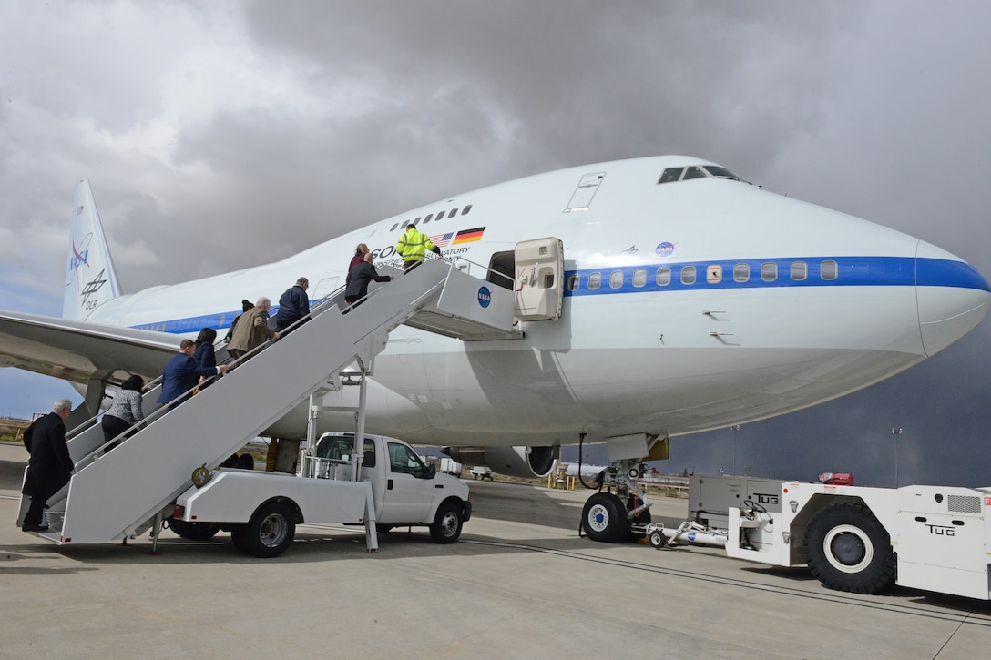 U.S. Congresswoman Katie Hill and her staff board NASA's flying research telescope aircraft SOFIA, which stands for Stratospheric Observatory For Infrared Astronomy. The newly elected congresswoman was given a tour of U.S. Air Force Plant 42 facilities Feb. 21. (U.S. Air Force photo by Kenji Thuloweit)