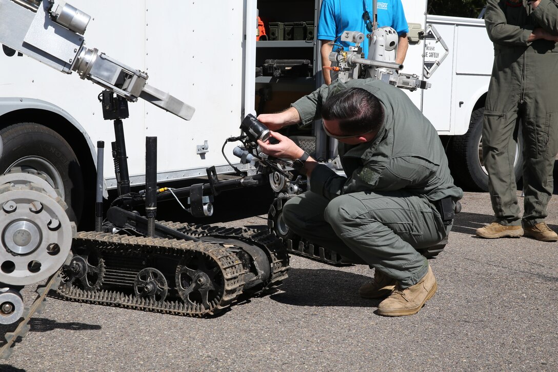 Sgt. Jeffrey Lysen, Explosive Ordnance Disposal (EOD) Technician with Headquarters and Headquarters Squadron, demonstrates the capabilities of the Mark II Talin camera, during the 2nd Annual Robotic Showcase Extravaganza 2019 in San Diego, Calif., Feb. 23. The Marines attended this event to teach students about robotics as well as foster cohesion with the surrounding community. (U.S. Marine Corps photo by Sgt. Sarah Ralph)