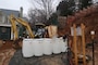 Crews fill drums with contaminated soil at 4825 Glenbrook Road during cleanup efforts there in February 2019. The 4825 Glenbrook Road cleanup effort is one ongoing aspect of the larger Spring Valley Formerly Used Defense Site.
