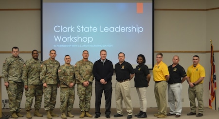 The 2019 Leadership Conference and Workshop group photo with Congressman Warren Davidson. There are soldiers in uniform and students gathers on a stage around the Congressman.