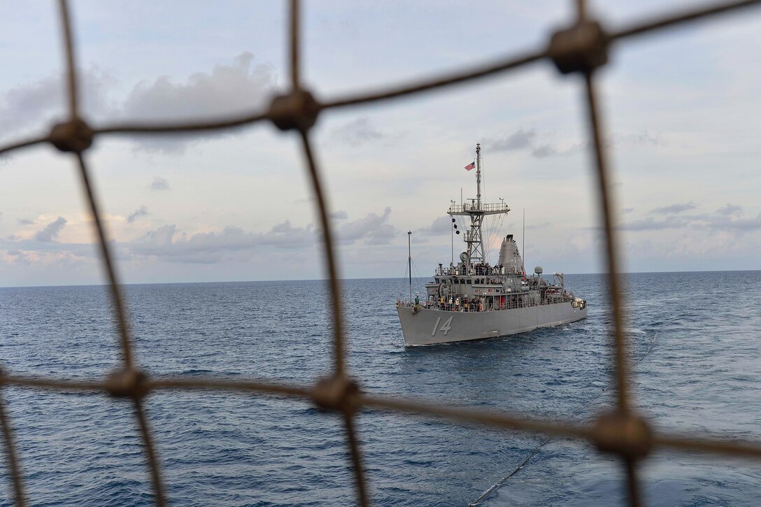 A ship transits the ocean during a replenishment.