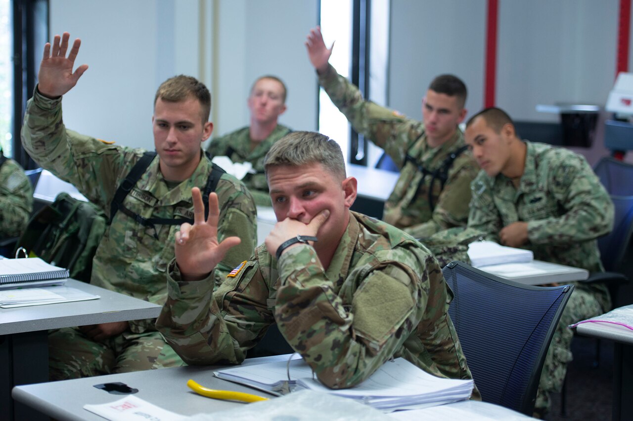 Instructors check dive equipment.