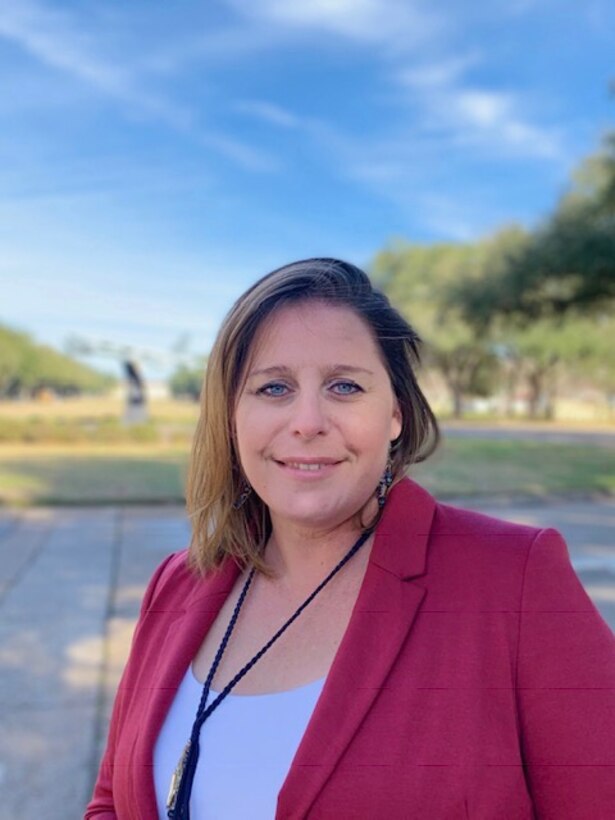 Julie Cooley stands before a replica of a B-52 Stratofortress at Barksdale Air Force Base, Louisiana.  She was named the Armed Forces Insurance Military Spouse of the Year 2019 for Barksdale AFB.  (courtesy photo)