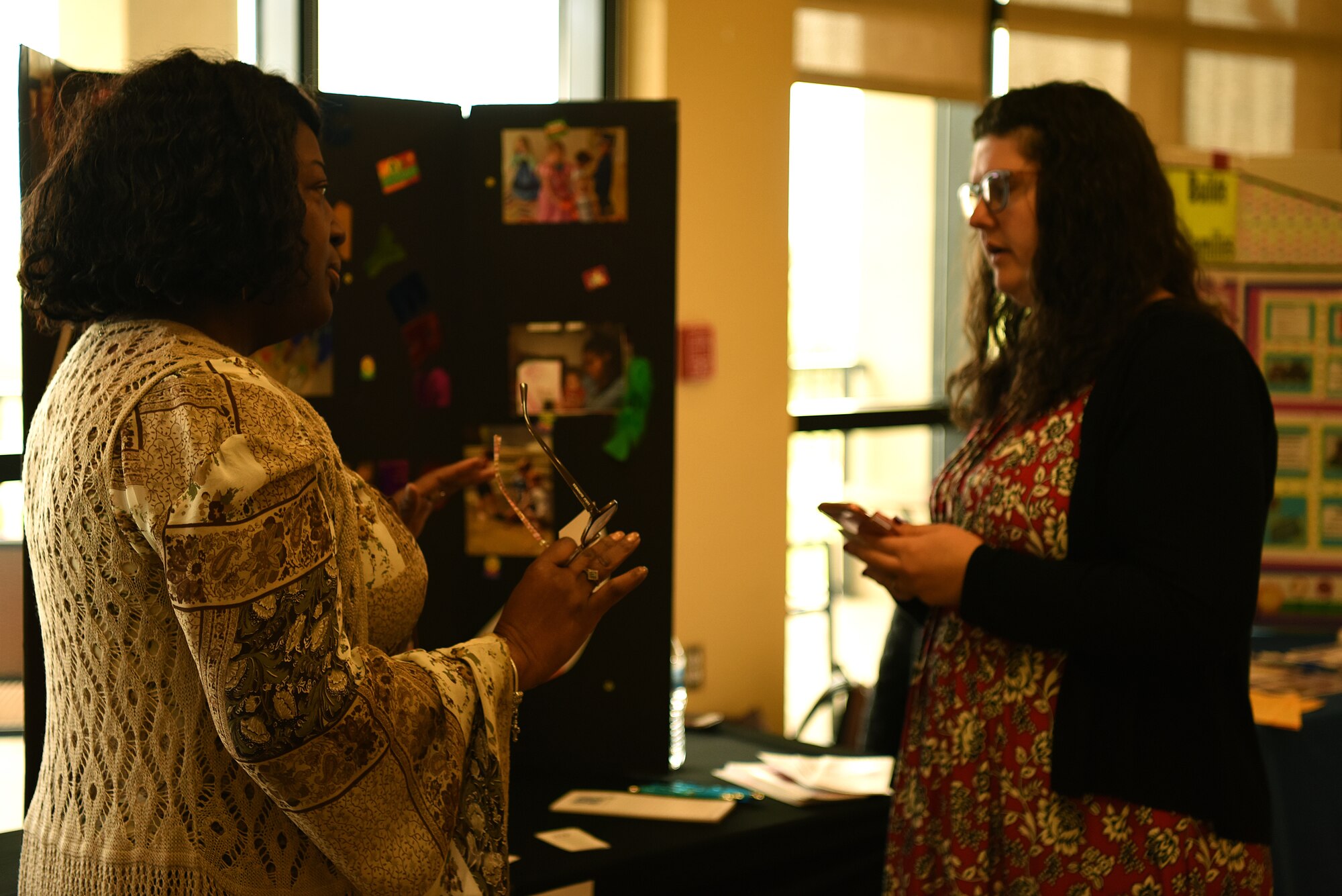 Anita Hymes, Community Child Care coordinator, speaks with Joy Brown, Airman and Family Readiness Center intern and base housing resident, during the Keesler Housing Review Open House inside the Bay Breeze Event Center at Keesler Air Force Base, Mississippi, Feb. 25, 2019. The open house gave military members and their families a chance to voice their housing concerns to leadership. (U.S. Air Force photo by Airman 1st Class Suzie Plotnikov)