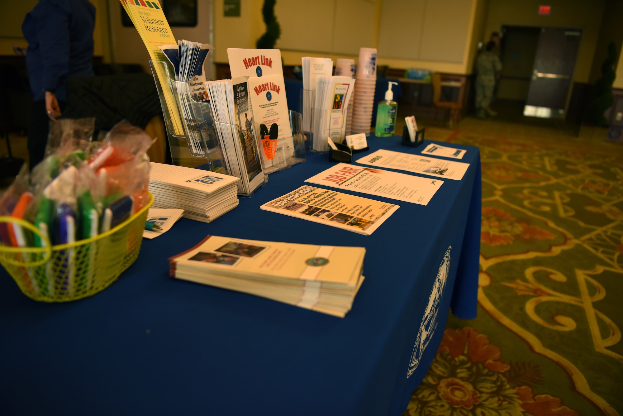 Airman and Family Readiness Center pamphlets are displayed on a booth during the Keesler Housing Review Open House inside the Bay Breeze Event Center at Keesler Air Force Base, Mississippi, Feb. 25, 2019. The open house gave military members and their families a chance to voice their housing concerns to leadership. (U.S. Air Force photo by Airman 1st Class Suzie Plotnikov)