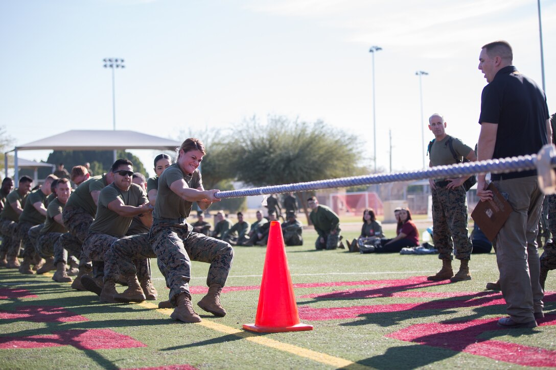 U.S. Marines stationed at Marine Corps Air Station (MCAS) Yuma, participate in the Tug-O-War event as part of the 3rd Annual Super Squadron at the MCAS Yuma Memorial Sports Complex January 11, 2019. The Super Squadron is a friendly competition between the various units on station, designed to help strengthen teamwork as well as boost station morale. Marine Air Control Squadron (MACS) 1 won the competition for the 3rd year in a row, with Headquarters & Headquarters Squadron (H&HS) coming in second. (U.S. Marine Corps photo by Cpl. Sabrina Candiaflores)