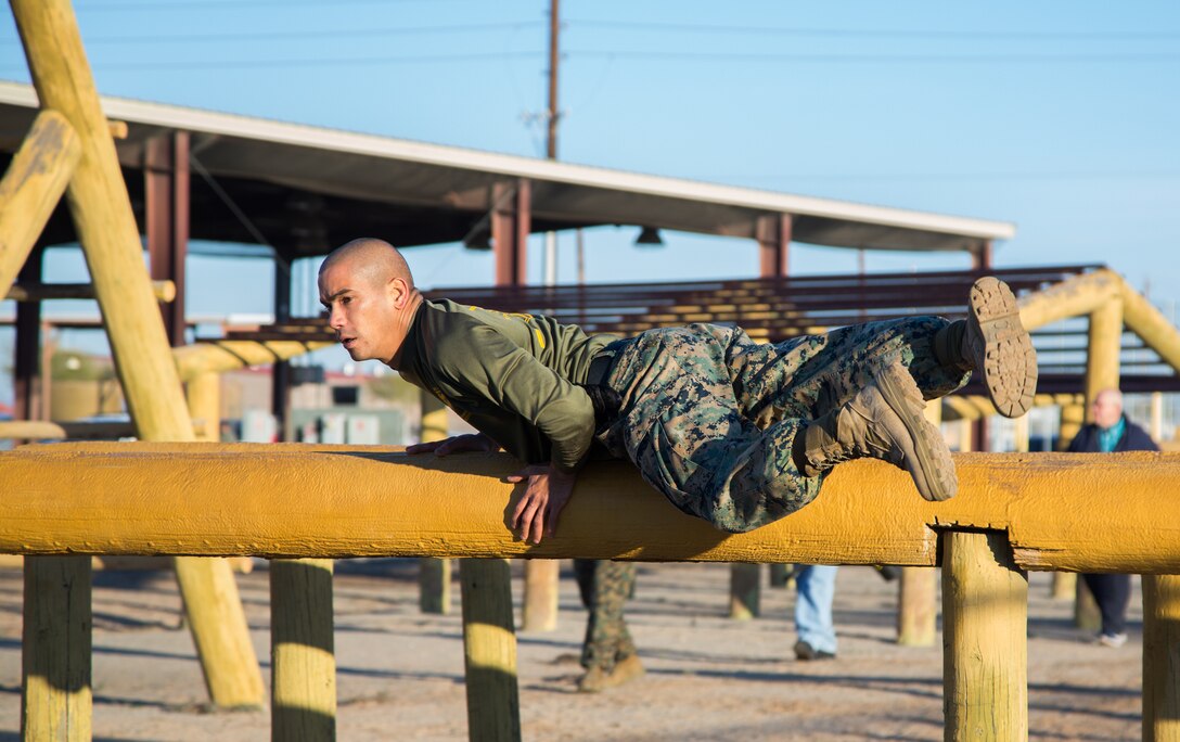 A U.S. Marine stationed at Marine Corps Air Station (MCAS) Yuma, runs through the Obstacle Course as part of the 3rd Annual Super Squadron event at the MCAS Yuma Memorial Sports Complex January 11, 2019. The Super Squadron is a friendly competition between the various units on station, designed to help strengthen teamwork as well as boost station morale. Marine Air Control Squadron (MACS) 1 won the competition for the 3rd year in a row, with Headquarters & Headquarters Squadron (H&HS) coming in second. (U.S. Marine Corps photo by Cpl. Sabrina Candiaflores)