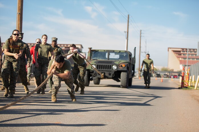 U.S. Marines stationed at Marine Corps Air Station (MCAS) Yuma, pull a HMMWV as part of the 3rd Annual Super Squadron at the MCAS Yuma Memorial Sports Complex January 11, 2019. The Super Squadron is a friendly competition between the various units on station, designed to help strengthen teamwork as well as boost station morale. Marine Air Control Squadron (MACS) 1 won the competition for the 3rd year in a row, with Headquarters & Headquarters Squadron (H&HS) coming in second. (U.S. Marine Corps photo by Cpl. Sabrina Candiaflores)