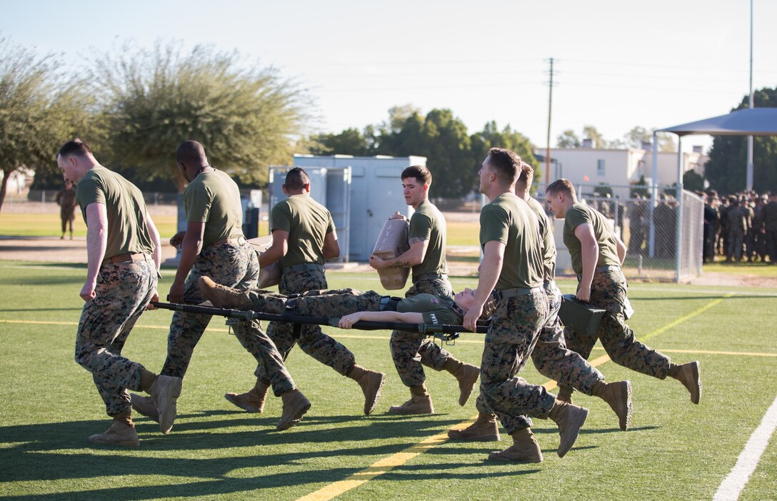 U.S. Marines stationed at Marine Corps Air Station (MCAS) Yuma, flip a tire as part of the 3rd Annual Super Squadron event at the MCAS Yuma Memorial Sports Complex January 11, 2019. The Super Squadron is a friendly competition between the various units on station, designed to help strengthen teamwork as well as boost station morale. Marine Air Control Squadron (MACS) 1 won the competition for the 3rd year in a row, with Headquarters & Headquarters Squadron (H&HS) coming in second. (U.S. Marine Corps photo by Cpl. Sabrina Candiaflores)