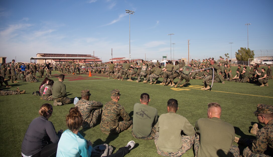 U.S. Marines stationed at Marine Corps Air Station (MCAS) Yuma, observe the Tug-O-War event during the 3rd Annual Super Squadron at the MCAS Yuma Memorial Sports Complex January 11, 2019. The Super Squadron is a friendly competition between the various units on station, designed to help strengthen teamwork as well as boost station morale. Marine Air Control Squadron (MACS) 1 won the competition for the 3rd year in a row, with Headquarters & Headquarters Squadron (H&HS) coming in second. (U.S. Marine Corps photo by Cpl. Sabrina Candiaflores)