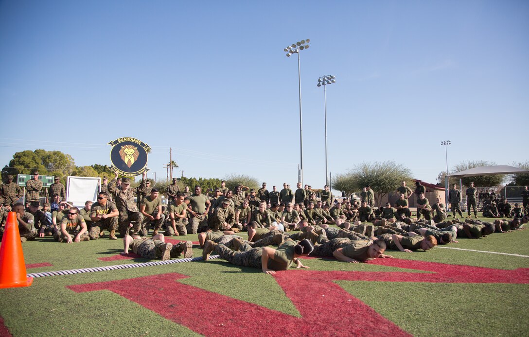 U.S. Marines stationed at Marine Corps Air Station (MCAS) Yuma, observe the Tug-O-War event during the 3rd Annual Super Squadron at the MCAS Yuma Memorial Sports Complex January 11, 2019. The Super Squadron is a friendly competition between the various units on station, designed to help strengthen teamwork as well as boost station morale. Marine Air Control Squadron (MACS) 1 won the competition for the 3rd year in a row, with Headquarters & Headquarters Squadron (H&HS) coming in second. (U.S. Marine Corps photo by Cpl. Sabrina Candiaflores)