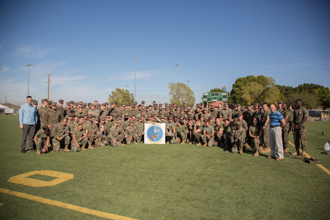 U.S. Marines stationed at Marine Corps Air Station (MCAS) Yuma, assigned to Marine Air Control Squadron (MACS) 1, pose for a photo after the 3rd Annual Super Squadron event at the MCAS Yuma Memorial Sports Complex January 11, 2019. The Super Squadron is a friendly competition between the various units on station, designed to help strengthen teamwork as well as boost station morale. MACS-1 won the competition for the 3rd year in a row, with Headquarters & Headquarters Squadron (H&HS) coming in second. (U.S. Marine Corps photo by Cpl. Sabrina Candiaflores)