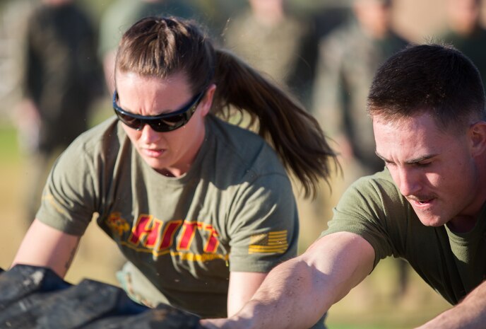 U.S. Marines stationed at Marine Corps Air Station (MCAS) Yuma, flip a tire as part of the 3rd Annual Super Squadron event at the MCAS Yuma Memorial Sports Complex January 11, 2019. The Super Squadron is a friendly competition between the various units on station, designed to help strengthen teamwork as well as boost station morale. Marine Air Control Squadron (MACS) 1 won the competition for the 3rd year in a row, with Headquarters & Headquarters Squadron (H&HS) coming in second. (U.S. Marine Corps photo by Cpl. Sabrina Candiaflores)