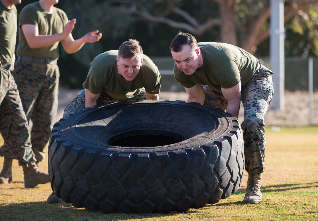 U.S. Marines stationed at Marine Corps Air Station (MCAS) Yuma, flip a tire as part of the 3rd Annual Super Squadron event at the MCAS Yuma Memorial Sports Complex January 11, 2019. The Super Squadron is a friendly competition between the various units on station, designed to help strengthen teamwork as well as boost station morale. Marine Air Control Squadron (MACS) 1 won the competition for the 3rd year in a row, with Headquarters & Headquarters Squadron (H&HS) coming in second. (U.S. Marine Corps photo by Cpl. Sabrina Candiaflores)