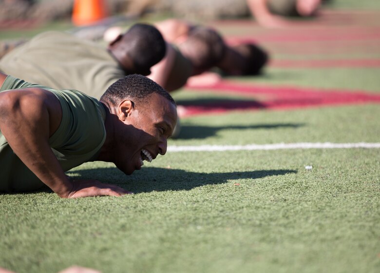 A U.S. Marine stationed at Marine Corps Air Station (MCAS) Yuma, gets ready to participate in the Tug-O-War event as part of the 3rd Annual Super Squadron at the MCAS Yuma Memorial Sports Complex January 11, 2019. The Super Squadron is a friendly competition between the various units on station, designed to help strengthen teamwork as well as boost station morale. Marine Air Control Squadron (MACS) 1 won the competition for the 3rd year in a row, with Headquarters & Headquarters Squadron (H&HS) coming in second. (U.S. Marine Corps photo by Cpl. Sabrina Candiaflores)