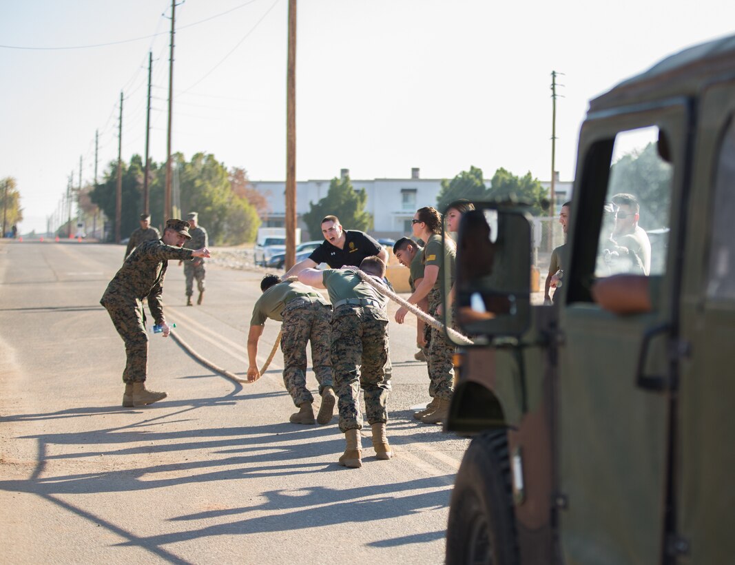 U.S. Marines stationed at Marine Corps Air Station (MCAS) Yuma, pull a HMMWV as part of the 3rd Annual Super Squadron at the MCAS Yuma Memorial Sports Complex January 11, 2019. The Super Squadron is a friendly competition between the various units on station, designed to help strengthen teamwork as well as boost station morale. Marine Air Control Squadron (MACS) 1 won the competition for the 3rd year in a row, with Headquarters & Headquarters Squadron (H&HS) coming in second. (U.S. Marine Corps photo by Cpl. Sabrina Candiaflores)