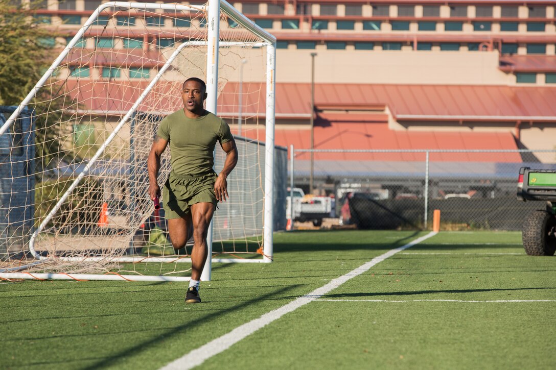 A U.S. Marine stationed at Marine Corps Air Station (MCAS) Yuma, sprints during a relay as part of the 3rd Annual Super Squadron event at the MCAS Yuma Memorial Sports Complex January 11, 2019. The Super Squadron is a friendly competition between the various units on station, designed to help strengthen teamwork as well as boost station morale. Marine Air Control Squadron (MACS) 1 won the competition for the 3rd year in a row, with Headquarters & Headquarters Squadron (H&HS) coming in second. (U.S. Marine Corps photo by Cpl. Sabrina Candiaflores)