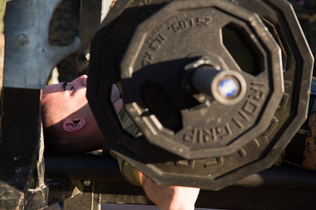 A U.S. Marine stationed at Marine Corps Air Station (MCAS) Yuma, does a bench press as part of the 3rd Annual Super Squadron event at the MCAS Yuma Memorial Sports Complex January 11, 2019. The Super Squadron is a friendly competition between the various units on station, designed to help strengthen teamwork as well as boost station morale. Marine Air Control Squadron (MACS) 1 won the competition for the 3rd year in a row, with Headquarters & Headquarters Squadron (H&HS) coming in second. (U.S. Marine Corps photo by Cpl. Sabrina Candiaflores)