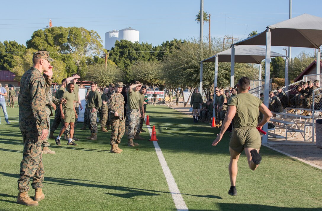 U.S. Marines stationed at Marine Corps Air Station (MCAS) Yuma, flip a tire as part of the 3rd Annual Super Squadron event at the MCAS Yuma Memorial Sports Complex January 11, 2019. The Super Squadron is a friendly competition between the various units on station, designed to help strengthen teamwork as well as boost station morale. Marine Air Control Squadron (MACS) 1 won the competition for the 3rd year in a row, with Headquarters & Headquarters Squadron (H&HS) coming in second. (U.S. Marine Corps photo by Cpl. Sabrina Candiaflores)