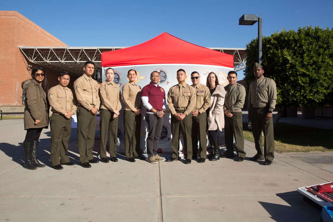 U.S. Marines stationed at Marine Corps Air Station (MCAS) Yuma and personnel from MCAS Yuma interact with high school students and speak about the risks of drugs and alcohol at Cibola High School in Yuma, Ariz., Jan. 22, 2019. The Marines and personnel used games and "beer goggles" to demonstrate the affects of alcohol and drugs. (U.S. Marine Corps photo by Cpl. Sabrina Candiaflores)