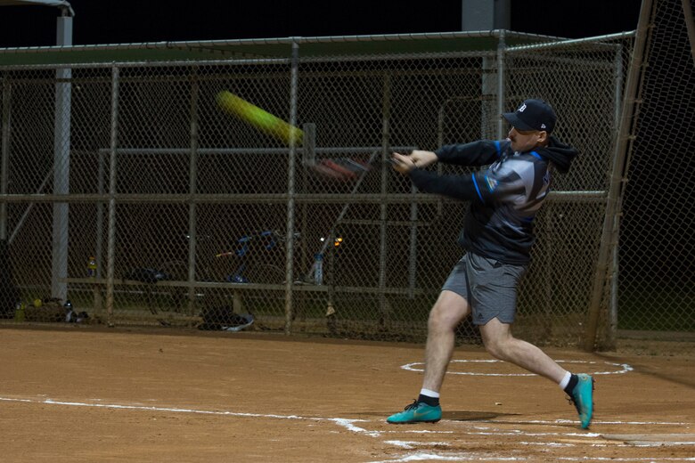 U.S. Marines, Sailors, and civilians with Marine Corps Air Station (MCAS) Yuma, participate in an intramural softball league on MCAS Yuma, Ariz., Jan. 24, 2019. The purpose of intramural sports is to provide opportunities for participation in a wide range of individual and team sports for both men and women regardless of skill level. (U.S. Marine Corps photo by Sgt. Allison Lotz)
