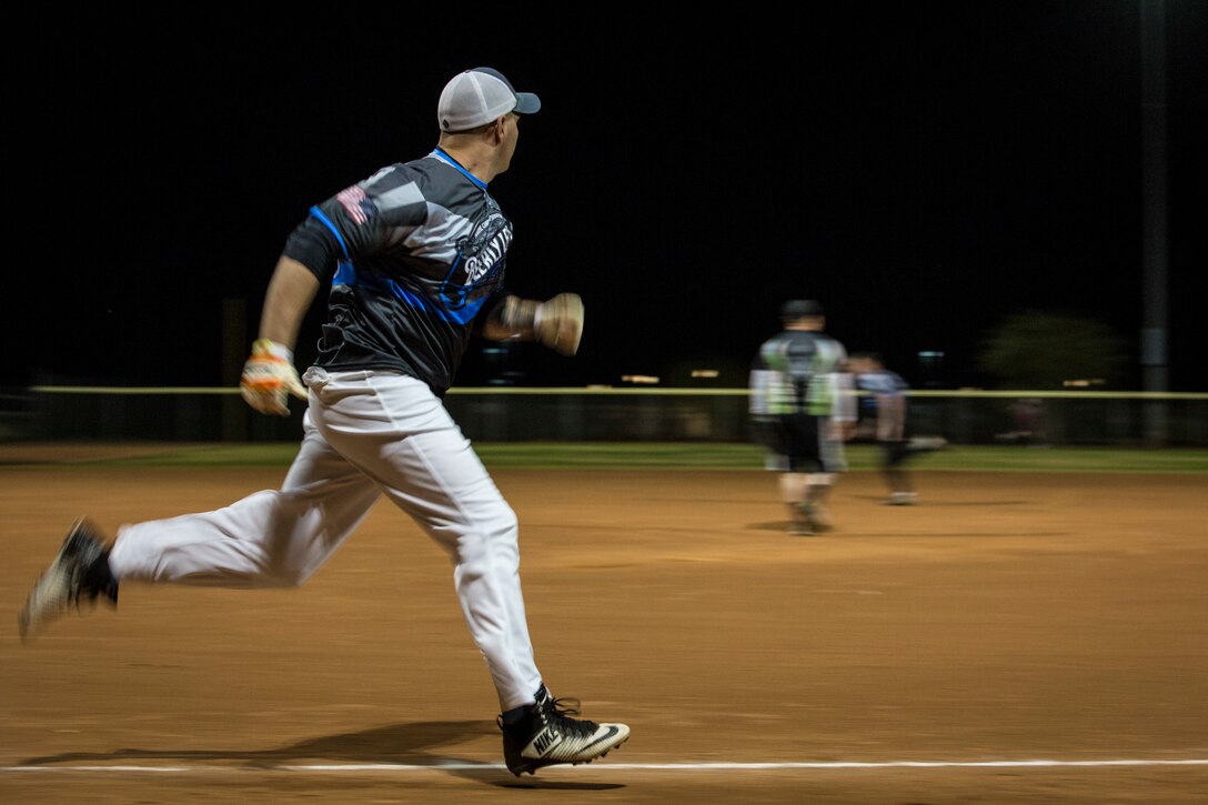 U.S. Marines, Sailors, and civilians with Marine Corps Air Station (MCAS) Yuma, participate in an intramural softball league on MCAS Yuma, Ariz., Jan. 24, 2019. The purpose of intramural sports is to provide opportunities for participation in a wide range of individual and team sports for both men and women regardless of skill level. (U.S. Marine Corps photo by Sgt. Allison Lotz)