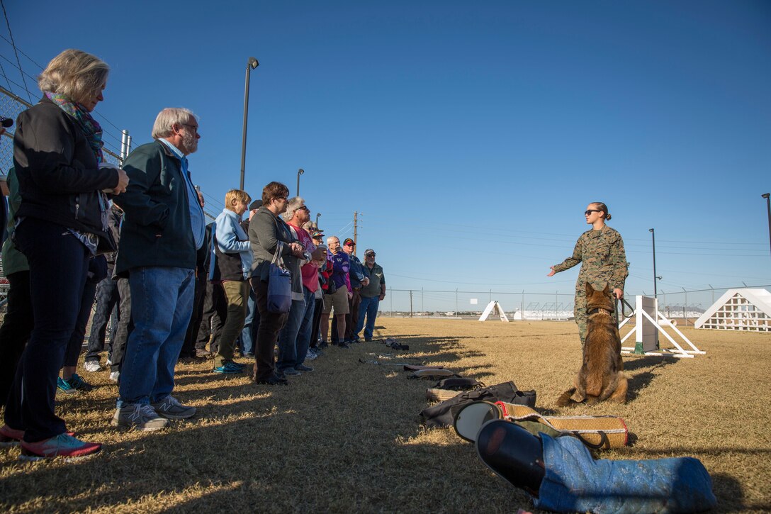 Guests participating in the Marine Corps Air Station (MCAS) Yuma Winter Tours observe a demonstration of the obstacle course, the Marine Corps Martial Arts Program (MCMAP), Explosive Ordinance Detection (EOD), and a military working dog demonstration at various locations on MCAS Yuma, Ariz., Feb. 6, 2019. Col. David A. Suggs, the station commanding officer, resumed the tours in 2018 to strengthen the relationship with the outside community and give them the opportunity to see what the Marines aboard the air station do. (U.S. Marine Corps photo by Sgt. Allison Lotz)