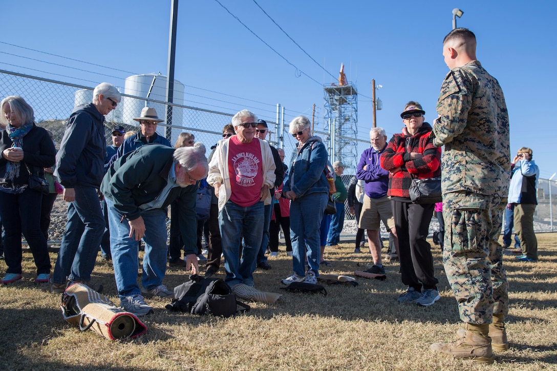 Guests participating in the Marine Corps Air Station (MCAS) Yuma Winter Tours observe a demonstration of the obstacle course, the Marine Corps Martial Arts Program (MCMAP), Explosive Ordinance Detection (EOD), and a military working dog demonstration at various locations on MCAS Yuma, Ariz., Feb. 6, 2019. Col. David A. Suggs, the station commanding officer, resumed the tours in 2018 to strengthen the relationship with the outside community and give them the opportunity to see what the Marines aboard the air station do. (U.S. Marine Corps photo by Sgt. Allison Lotz)