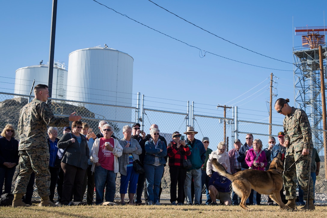 Guests participating in the Marine Corps Air Station (MCAS) Yuma Winter Tours observe a demonstration of the obstacle course, the Marine Corps Martial Arts Program (MCMAP), Explosive Ordinance Detection (EOD), and a military working dog demonstration at various locations on MCAS Yuma, Ariz., Feb. 6, 2019. Col. David A. Suggs, the station commanding officer, resumed the tours in 2018 to strengthen the relationship with the outside community and give them the opportunity to see what the Marines aboard the air station do. (U.S. Marine Corps photo by Sgt. Allison Lotz)