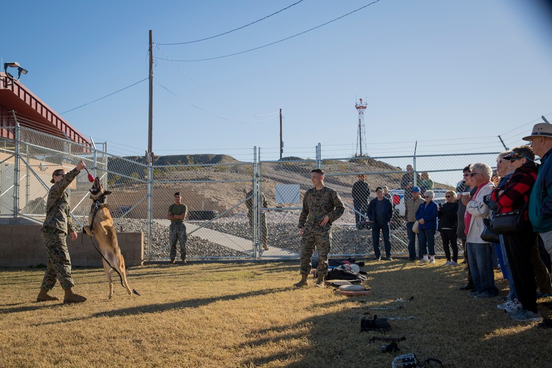 Guests participating in the Marine Corps Air Station (MCAS) Yuma Winter Tours observe a demonstration of the obstacle course, the Marine Corps Martial Arts Program (MCMAP), Explosive Ordinance Detection (EOD), and a military working dog demonstration at various locations on MCAS Yuma, Ariz., Feb. 6, 2019. Col. David A. Suggs, the station commanding officer, resumed the tours in 2018 to strengthen the relationship with the outside community and give them the opportunity to see what the Marines aboard the air station do. (U.S. Marine Corps photo by Sgt. Allison Lotz)