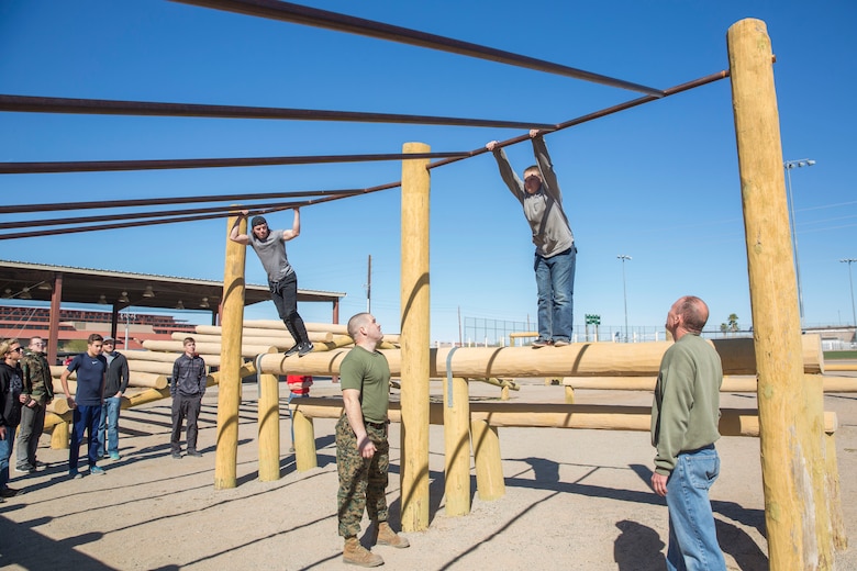 The Young Marines and Boy Scouts from Kingman, Ariz., visited Marine Corps Air Station (MCAS) Yuma Feb. 8, 2019. U.S. Marines stationed at MCAS Yuma demonstrated Explosive Ordnance Disposal (EOD) capabilities, Marine Corps Martial Arts Program (MCMAP) techniques, the Obstacle Course, and the Combat Fitness Test (CFT). The Young Marines and Boy Scouts also participated in some of these events. (U.S. Marine Corps photo by Cpl. Sabrina Candiaflores)
