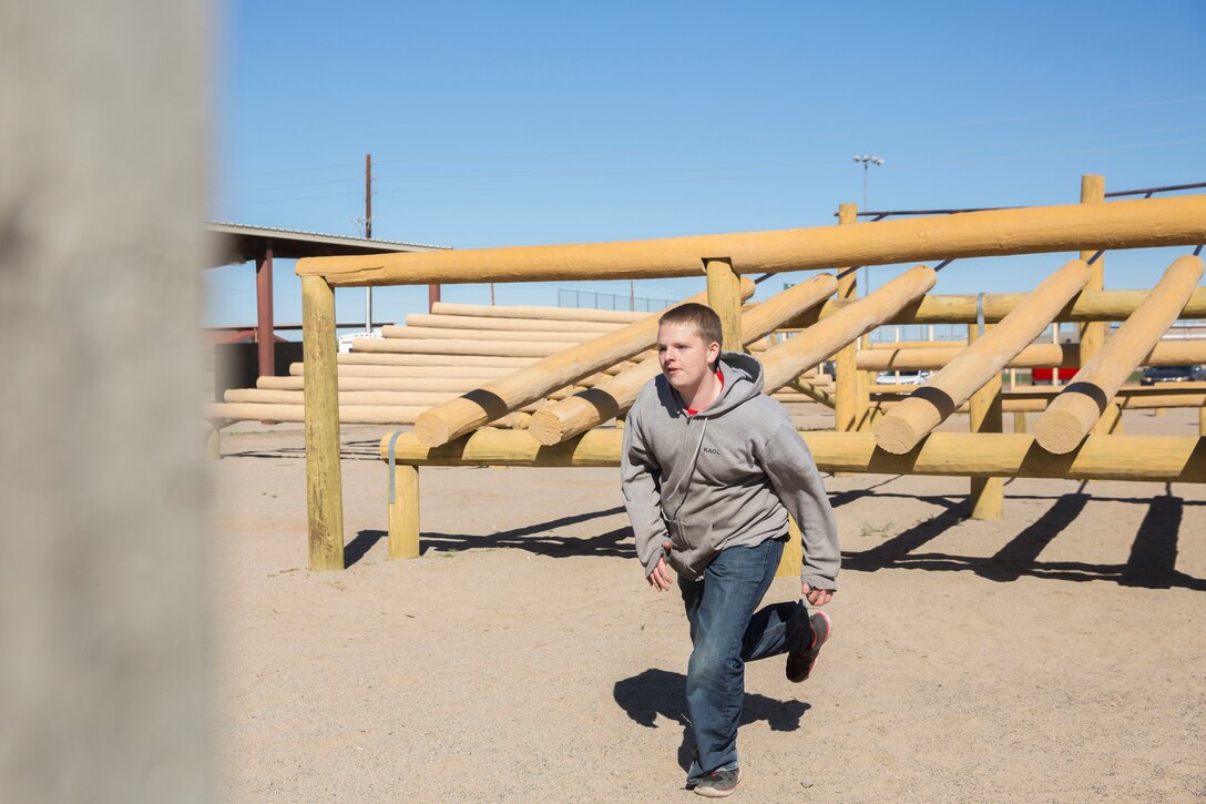 The Young Marines and Boy Scouts from Kingman, Ariz., visited Marine Corps Air Station (MCAS) Yuma Feb. 8, 2019. U.S. Marines stationed at MCAS Yuma demonstrated Explosive Ordnance Disposal (EOD) capabilities, Marine Corps Martial Arts Program (MCMAP) techniques, the Obstacle Course, and the Combat Fitness Test (CFT). The Young Marines and Boy Scouts also participated in some of these events. (U.S. Marine Corps photo by Cpl. Sabrina Candiaflores)