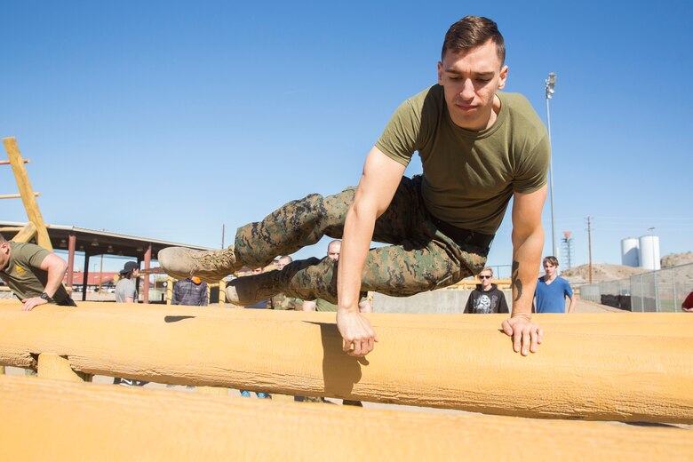 The Young Marines and Boy Scouts from Kingman, Ariz., visited Marine Corps Air Station (MCAS) Yuma Feb. 8, 2019. U.S. Marines stationed at MCAS Yuma demonstrated Explosive Ordnance Disposal (EOD) capabilities, Marine Corps Martial Arts Program (MCMAP) techniques, the Obstacle Course, and the Combat Fitness Test (CFT). The Young Marines and Boy Scouts also participated in some of these events. (U.S. Marine Corps photo by Cpl. Sabrina Candiaflores)