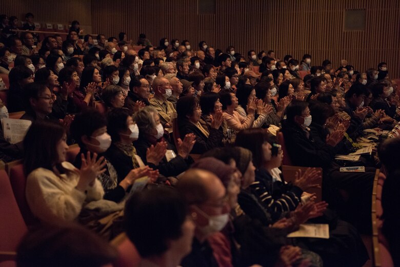 Audience members applaud during the Japan-U.S. Joint Concert Feb. 24, 2019, at the Hamura Learning Center in Hamura, Tokyo, Japan. The purpose of the joint concert was to strengthen friendships and partnerships with the local communities. (U.S. Air Force photo by Senior Airman Donald Hudson)