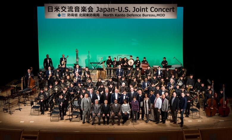 The special guests join the band for a group photo after a Japan-U.S. Joint Concert Feb. 24, 2019, at the Hamura Learning Center in Hamura, Tokyo, Japan. This year marks the 11th annual Japan-U.S. Joint Concert event organized by the North Kanto Defense Bureau Ministry of Defense and acts as an avenue in strengthening the partnerships and alliances between Yokota Air Base and the local communities. (U.S. Air Force photo by Senior Airman Donald Hudson)