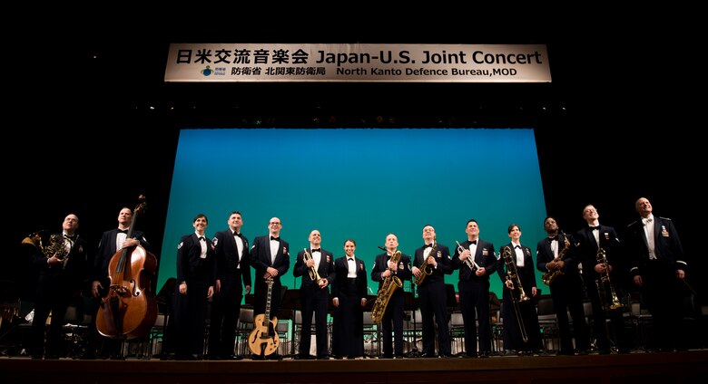 The USAF Band of the Pacific pose for a photo after the Japan-U.S. Joint Concert Feb. 24, 2019, at the Hamura Learning Center in Hamura, Tokyo, Japan. The concert included various jazz, big band, and orchestra performance numbers by the USAF Band of the Pacific and the Hamura Daiichi Jr. High School Band. (U.S. Air Force photo by Senior Airman Donald Hudson)